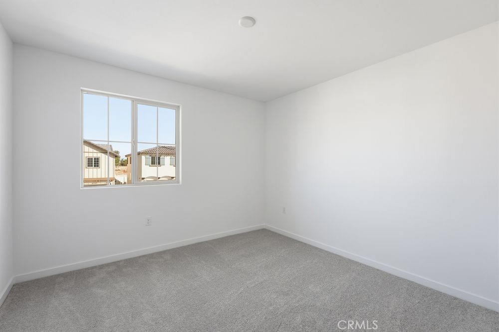 9575 Silverstein Drive Riverside, CA 92508 - Photo 14 of 22 an empty room with a window