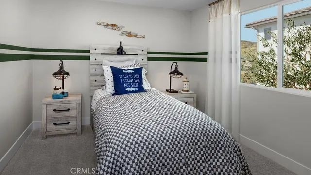 a bedroom with a bed mirror and a window