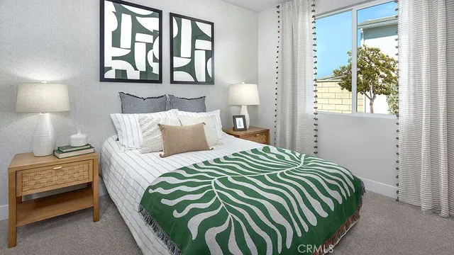 a bedroom with a bed and a chair