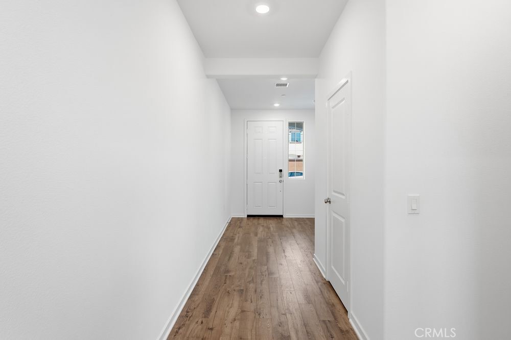 9575 Silverstein Drive Riverside, CA 92508 - Photo 18 of 22 a view of a room with wooden floor