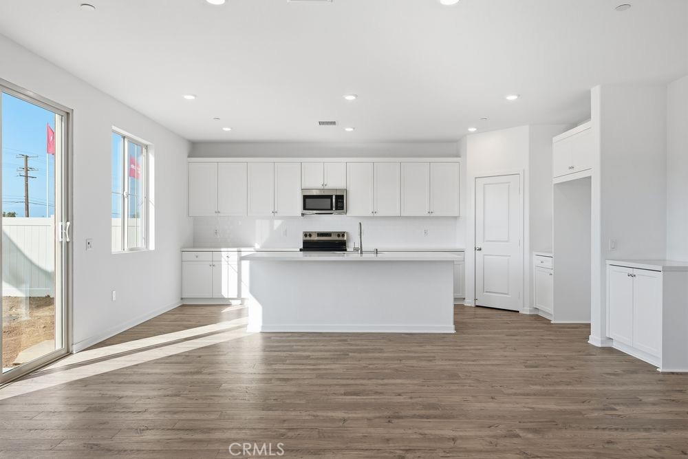 9575 Silverstein Drive Riverside, CA 92508 - Photo 2 of 22 a view of kitchen with granite countertop cabinets and refrigerator