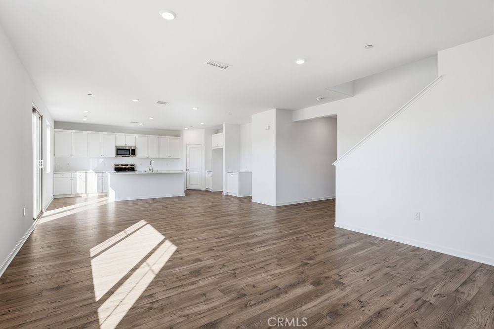 9575 Silverstein Drive Riverside, CA 92508 - Photo 5 of 22 a view of kitchen with cabinets and wooden floor