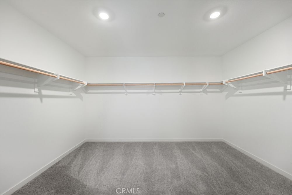 9575 Silverstein Drive Riverside, CA 92508 - Photo 9 of 22 a view of a room with racks on the wall