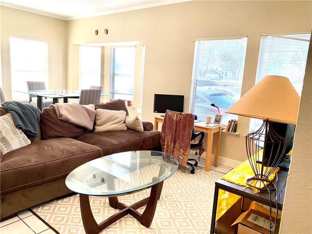 503 East 38th Street, Unit B Austin, TX 78705 - Photo 5 of 11 Living area with plenty of natural light and crown molding