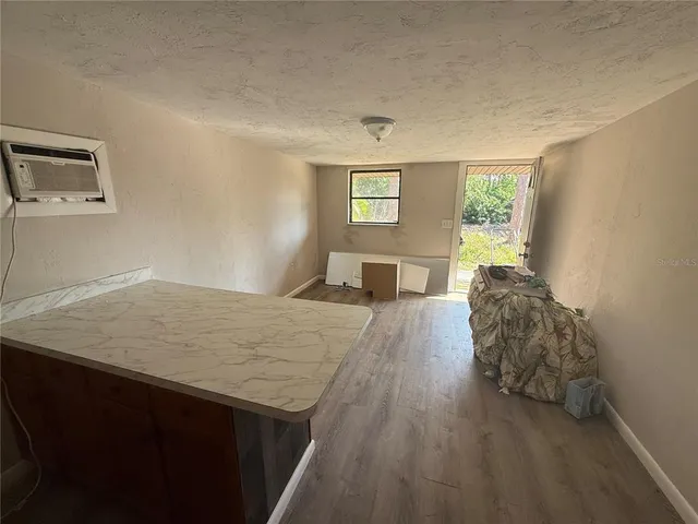 a kitchen with stainless steel appliances a stove a sink and a refrigerator