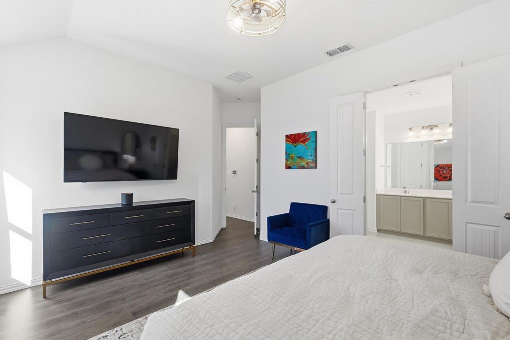 7508 Rhyner Way Fort Worth, TX 76137 - Photo 13 of 23 Alternate view of primary bedroom. Ensuite bathroom with french doors.