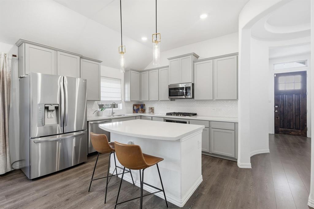 7508 Rhyner Way Fort Worth, TX 76137 - Photo 6 of 23 Kitchen island with room for seating.