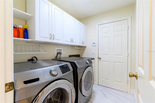 an empty room with windows and outdoor view