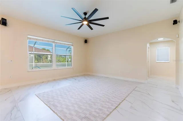 a view of an empty room with a window