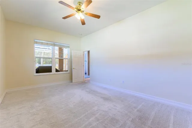 a bathroom with a granite countertop sink and a bathtub