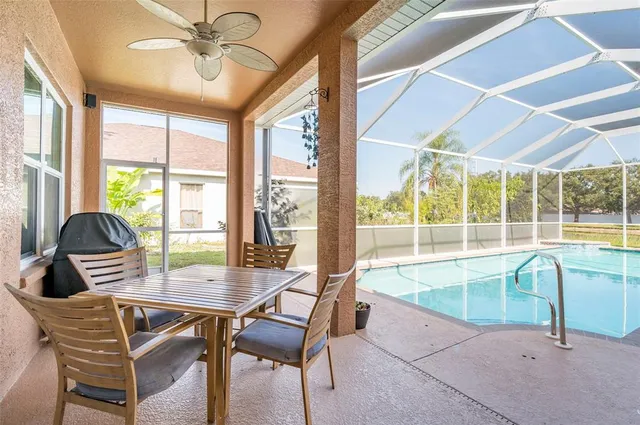 a view of a dining room with furniture wooden floor and a potted plant