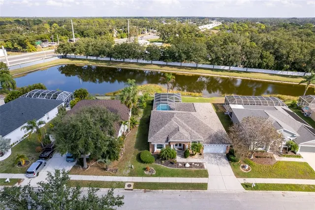 an aerial view of a house with a lake view