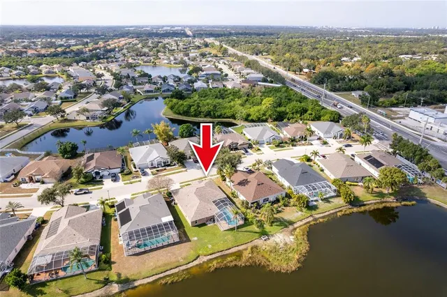 an aerial view of residential houses with outdoor space