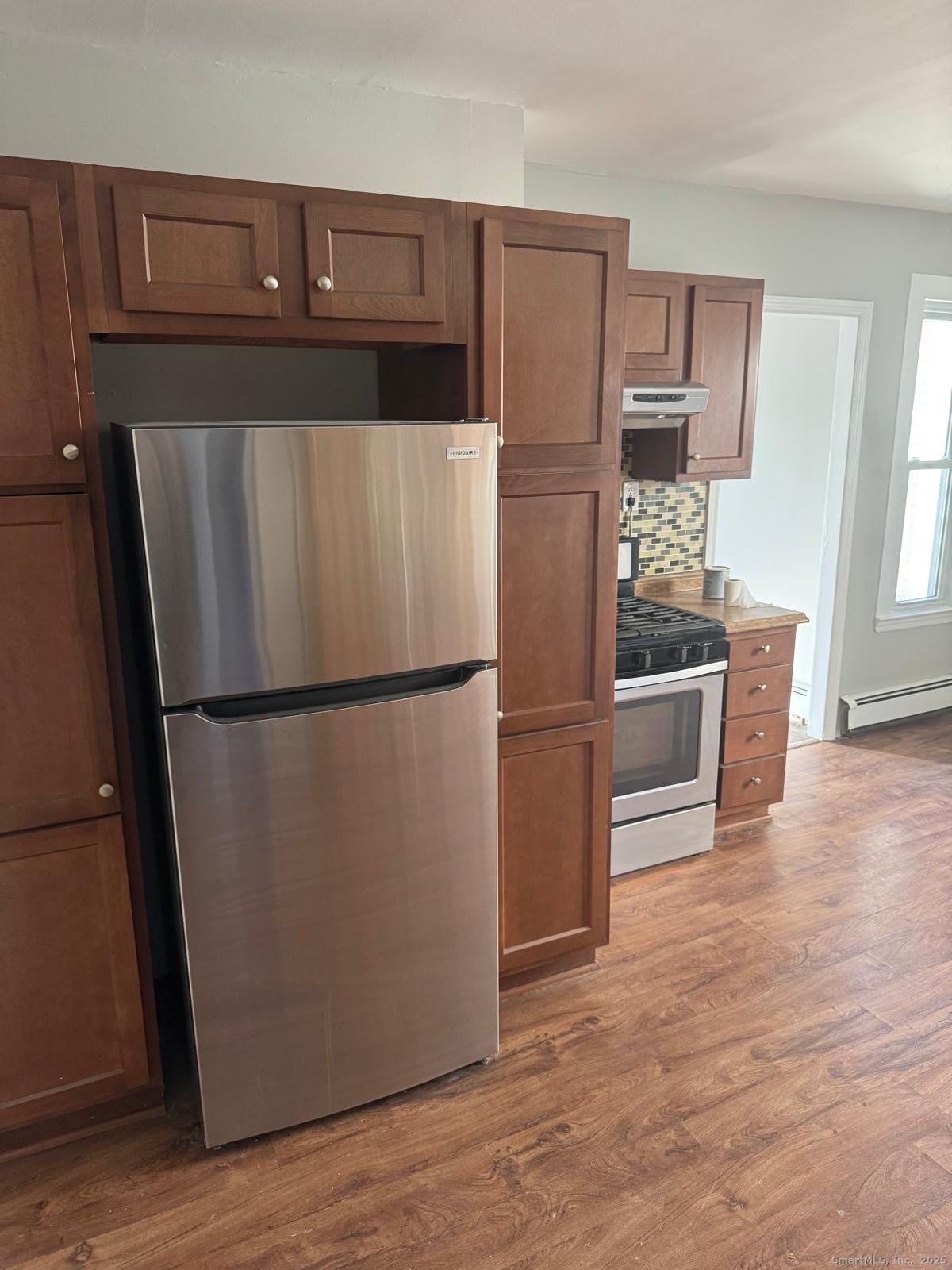 422 Lafayette Street, Unit 1R Bridgeport, CT 06604 - Photo 1 of 15 a kitchen with stainless steel appliances a refrigerator and a stove