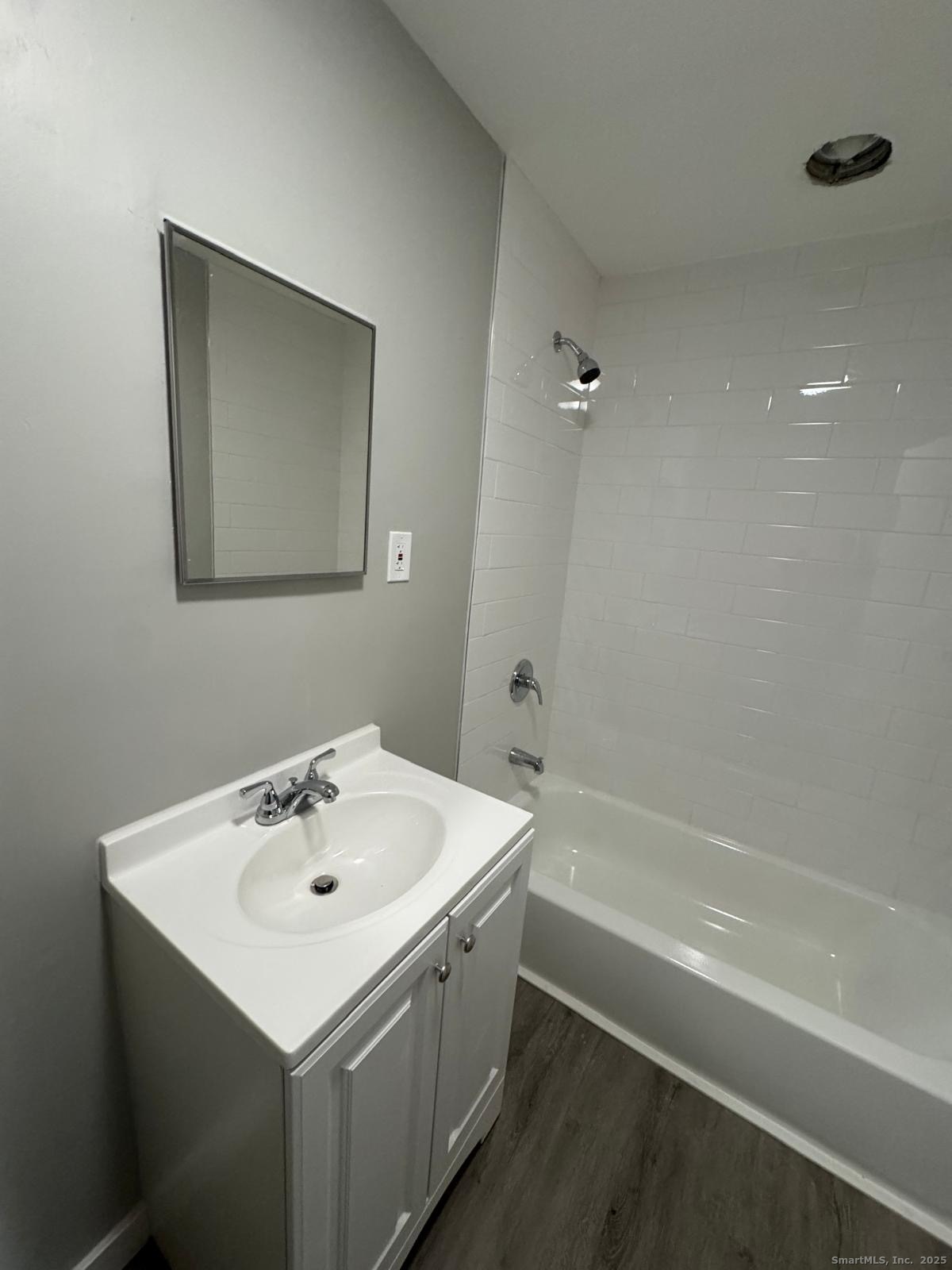 422 Lafayette Street, Unit 1R Bridgeport, CT 06604 - Photo 11 of 15 a bathroom with a sink and a bathtub