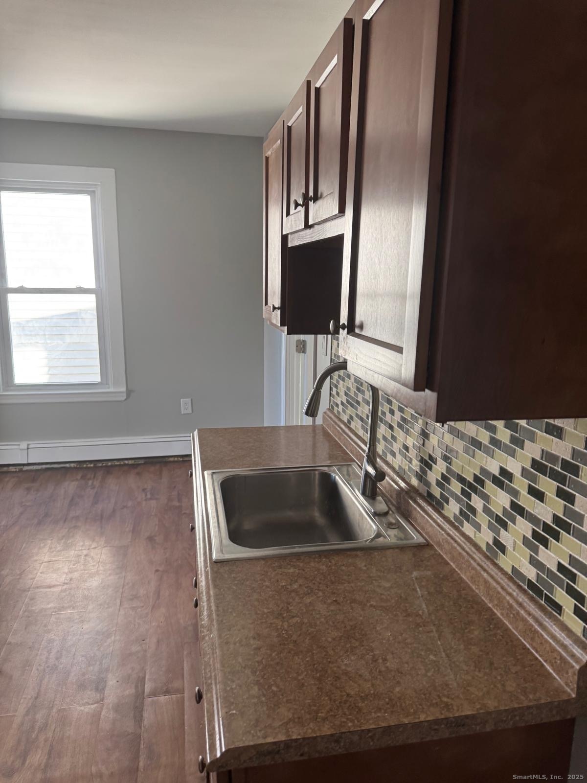 422 Lafayette Street, Unit 1R Bridgeport, CT 06604 - Photo 15 of 15 a bathroom with mirror sink and window