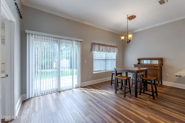 a bathroom with a double vanity sink and mirror
