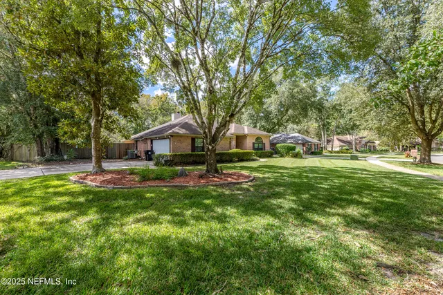 a view of a hallway view with wooden floor and staircase