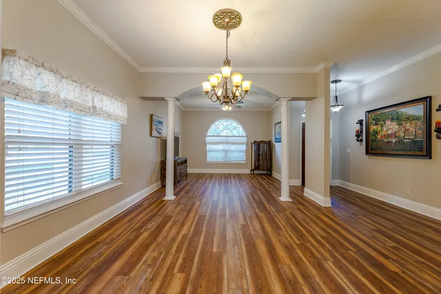 a view of a dining room with furniture window and wooden floor