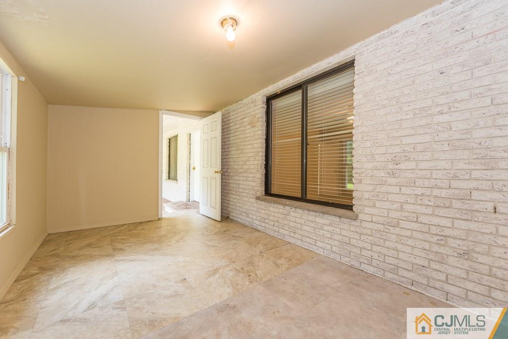 1518 Englishtown Road Old Bridge, NJ 08857 - Photo 12 of 25 a view of an empty room with a window