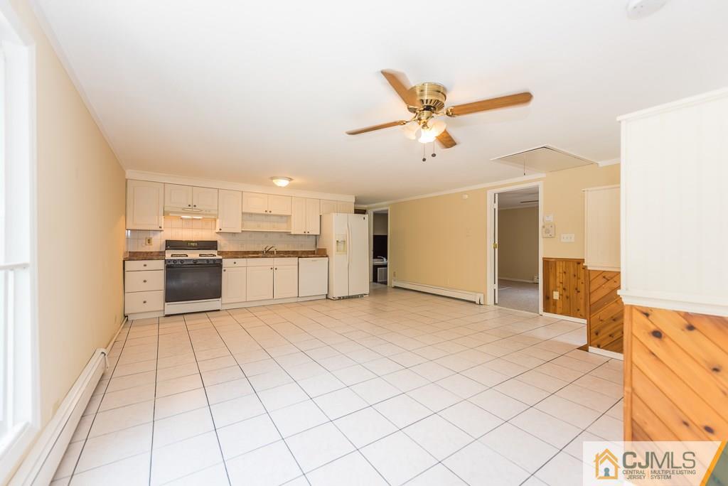 1518 Englishtown Road Old Bridge, NJ 08857 - Photo 14 of 25 a view of a kitchen with a sink and a refrigerator