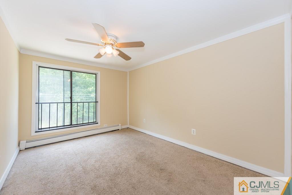 1518 Englishtown Road Old Bridge, NJ 08857 - Photo 17 of 25 wooden floor in an empty room with a window