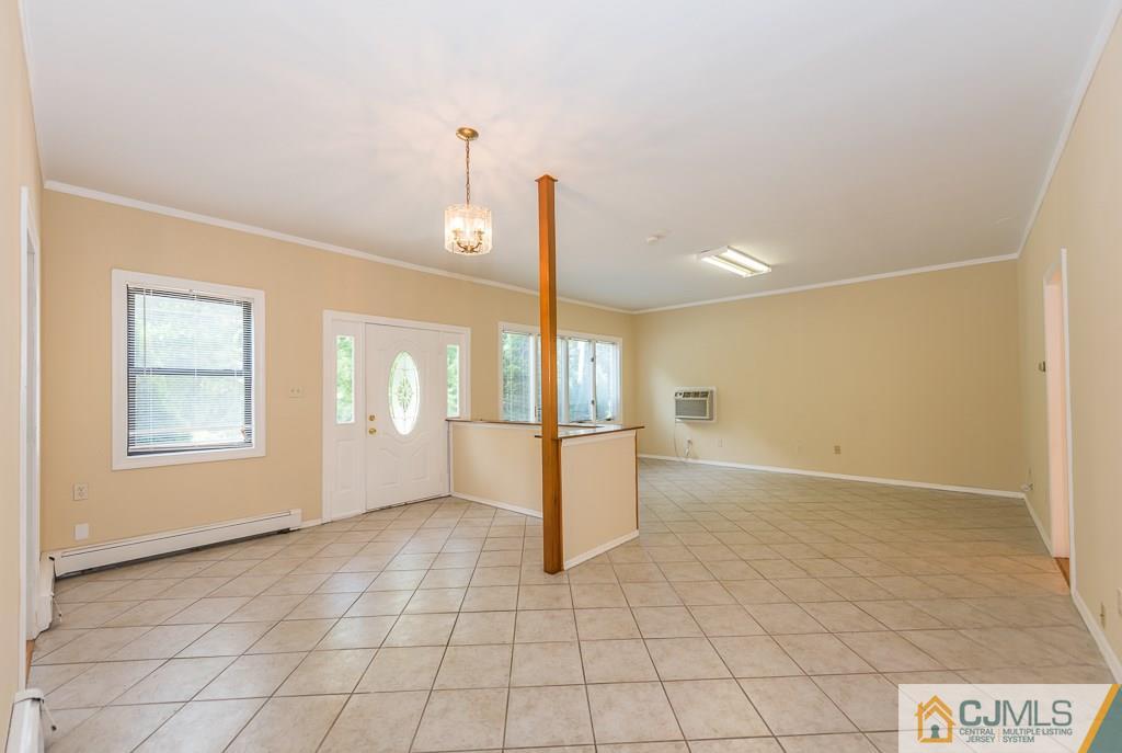 1518 Englishtown Road Old Bridge, NJ 08857 - Photo 3 of 25 a view of an empty room with a window