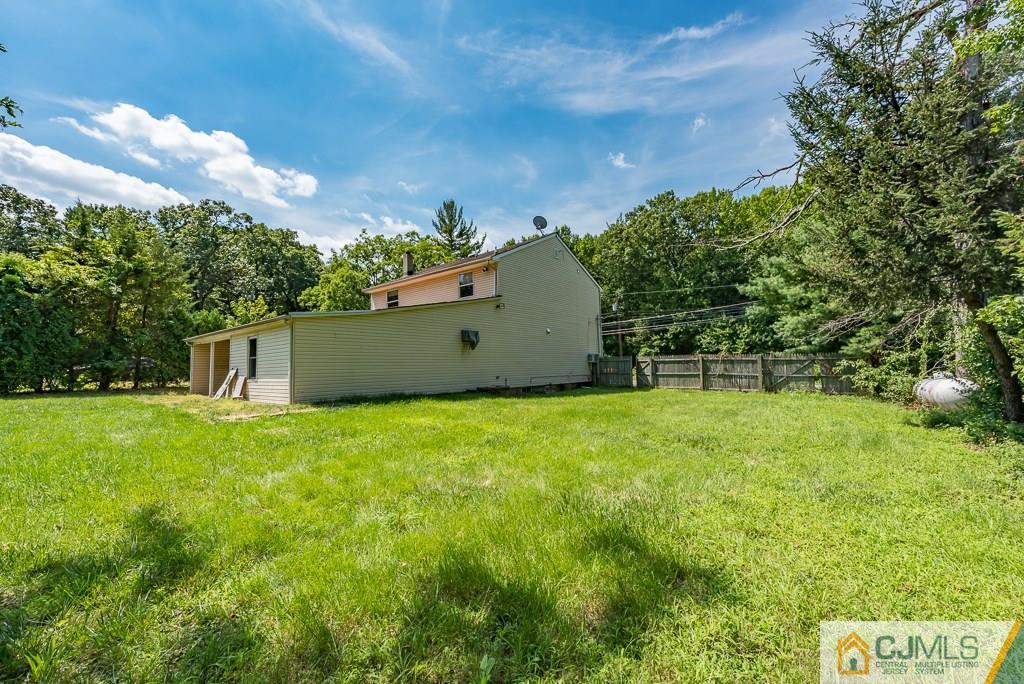 1518 Englishtown Road Old Bridge, NJ 08857 - Photo 25 of 25 a backyard of a house with lots of green space