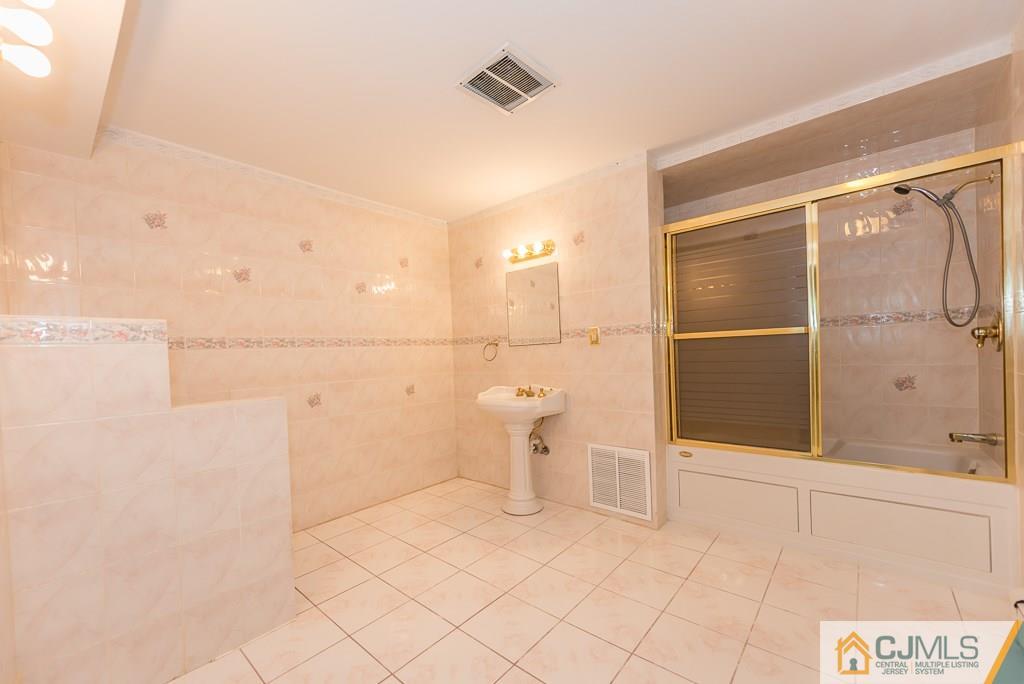 1518 Englishtown Road Old Bridge, NJ 08857 - Photo 4 of 25 a bathroom with a shower and toilet