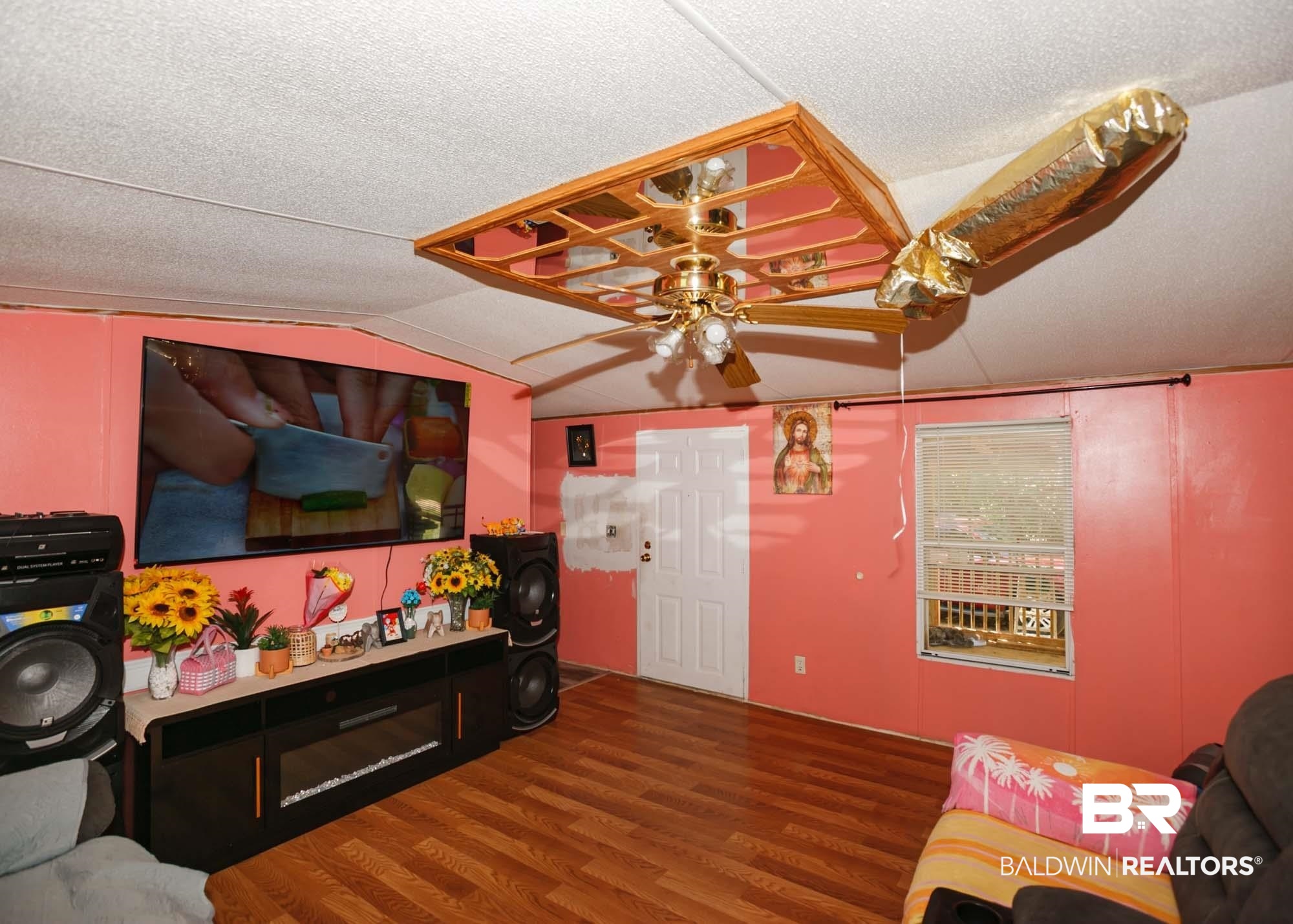 14005 County Road 49 Foley, AL 36535 - Photo 13 of 38 Living area featuring wood finished floors, a ceiling fan, lofted ceiling, and a textured ceiling