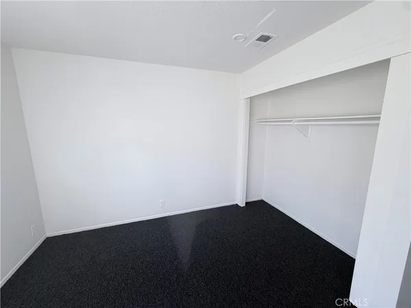 an empty room with a closet