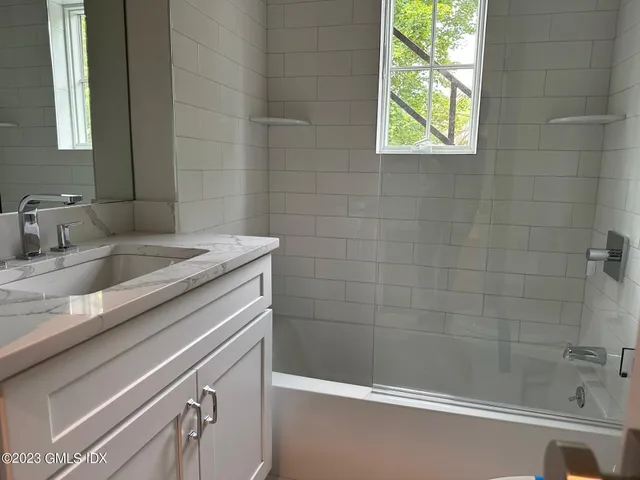 a bathroom with a sink and a bathtub