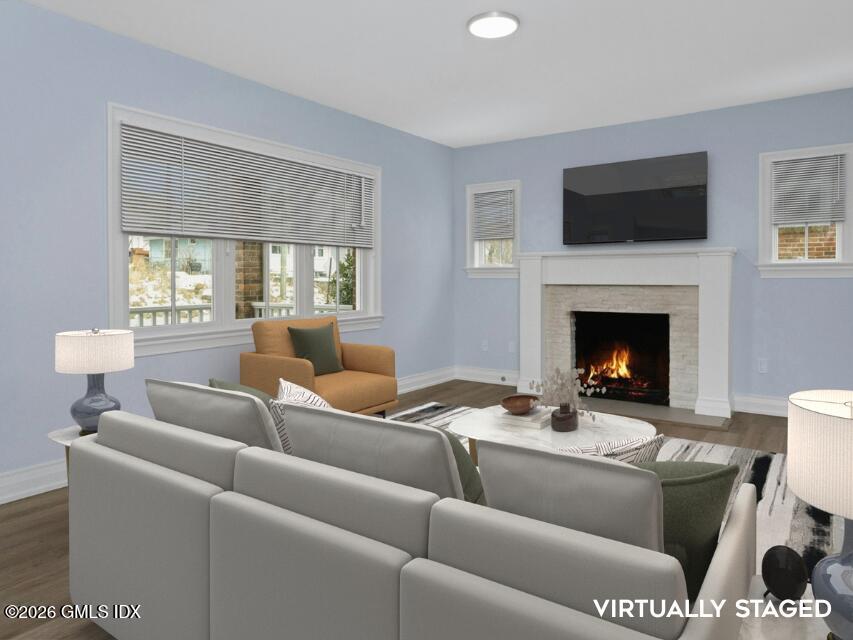 104 Pemberwick Road, Unit 1 Greenwich, CT 06831 - Photo 4 of 18 a living room with furniture a flat screen tv and a fireplace