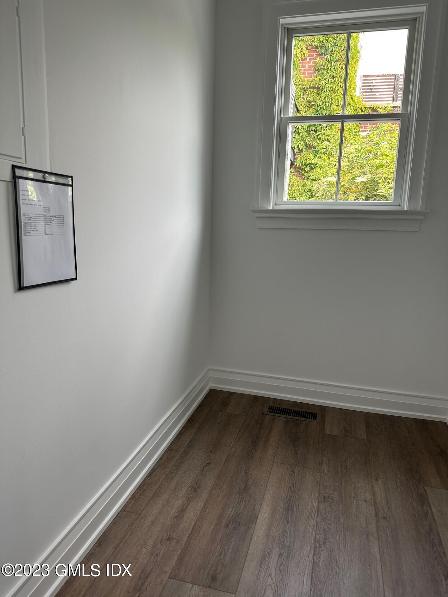 104 Pemberwick Road, Unit 1 Greenwich, CT 06831 - Photo 10 of 18 an empty room with a window