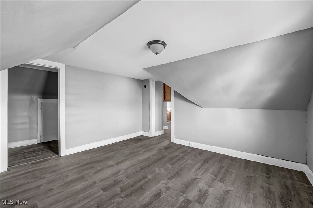 1854 Grantham Road Cleveland, OH 44112 - Photo 31 of 47 Additional living space with dark wood finished floors and lofted ceiling