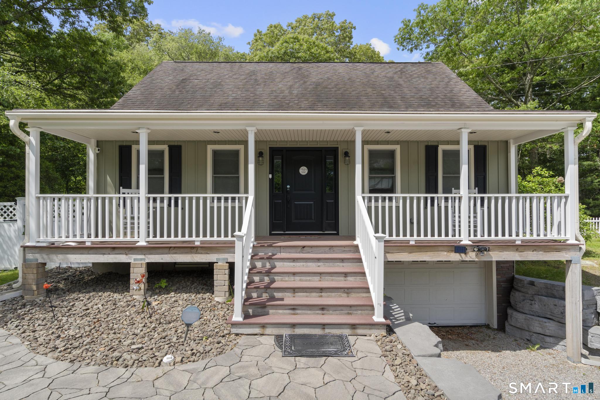 13 Christy Hill Road Ledyard, CT 06335 - Photo 2 of 38 a view of a house with a small yard and wooden fence