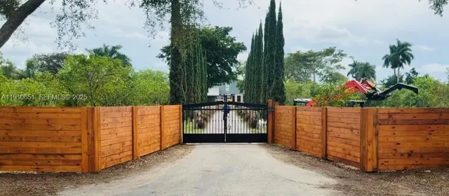 a view of a fence in front of house