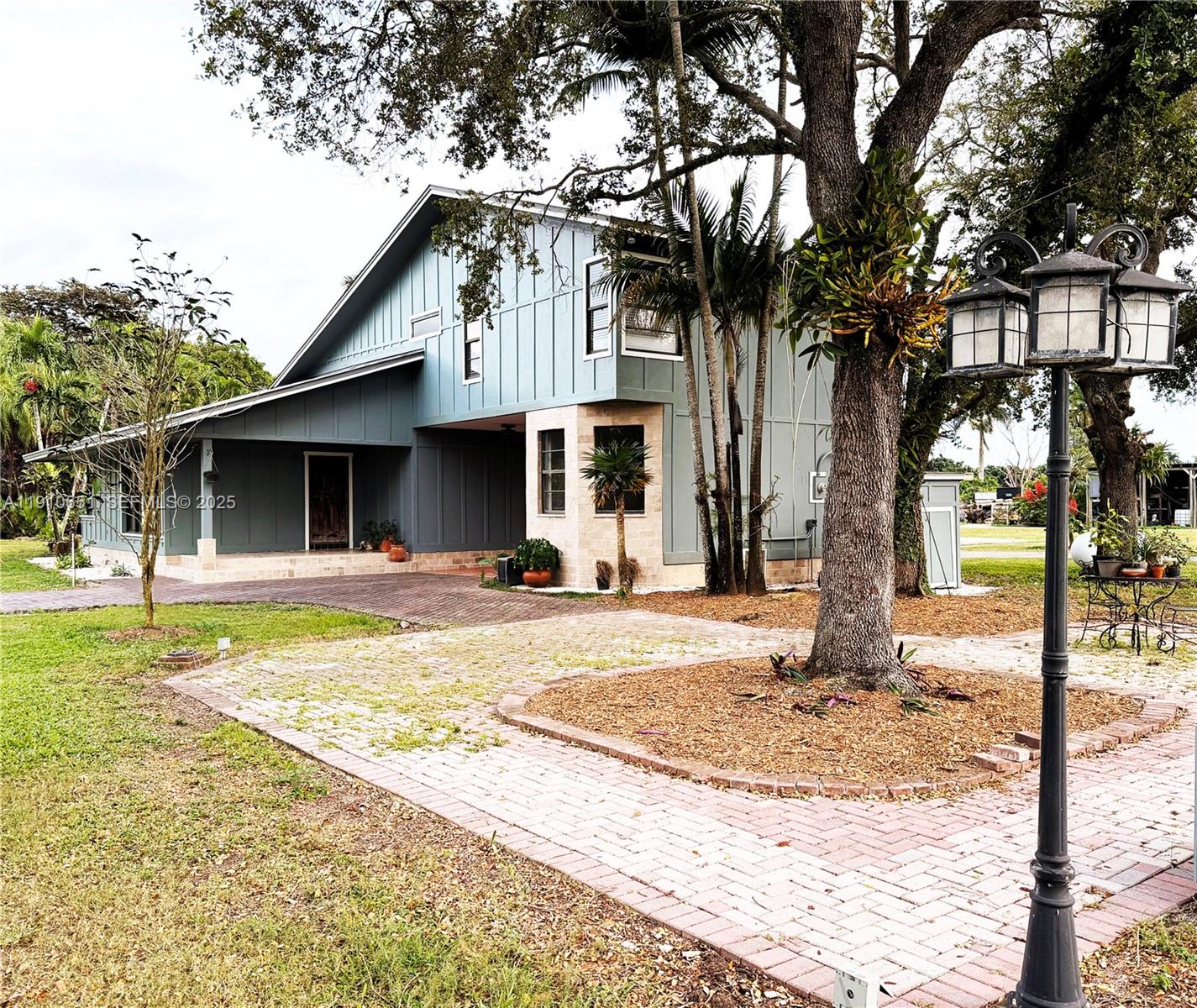 19820 Southwest 244th Street Homestead, FL 33031 - Photo 36 of 99 a front view of a house with garden