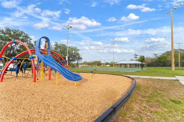 a view of swimming pool with a yard