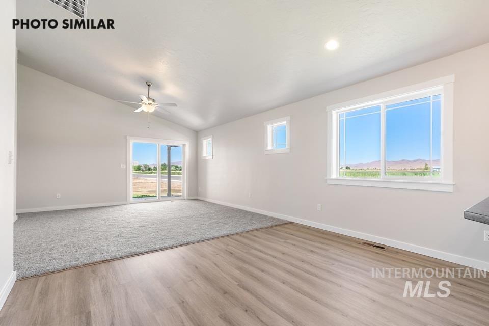 1693 Rapid Road Emmett, ID 83617 - Photo 6 of 28 Spacious room featuring vaulted ceilings, a ceiling fan, and recessed lighting