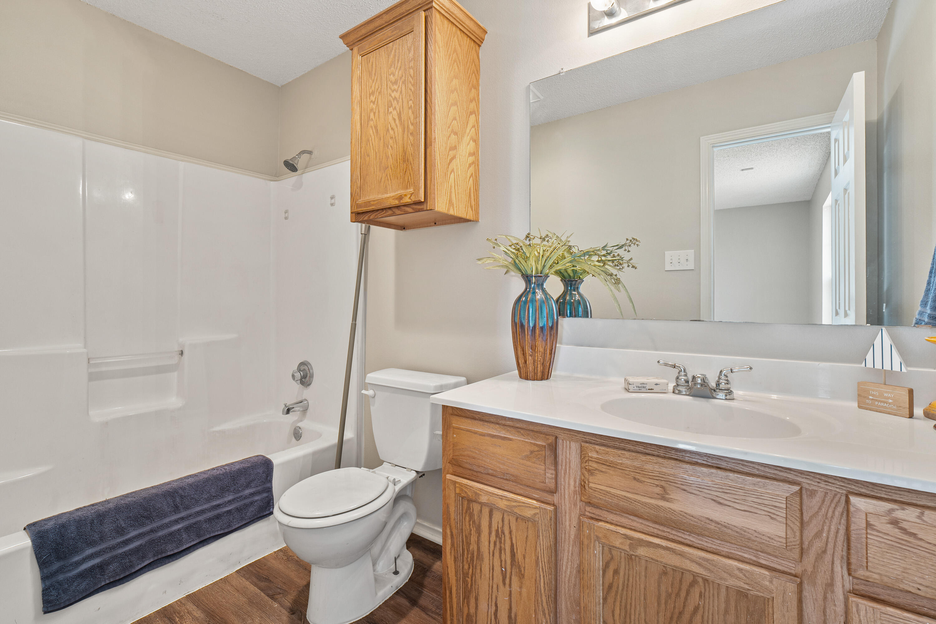 6517 91st Street Lubbock, TX 79424 - Photo 6 of 11 a bathroom with a sink a toilet and shower