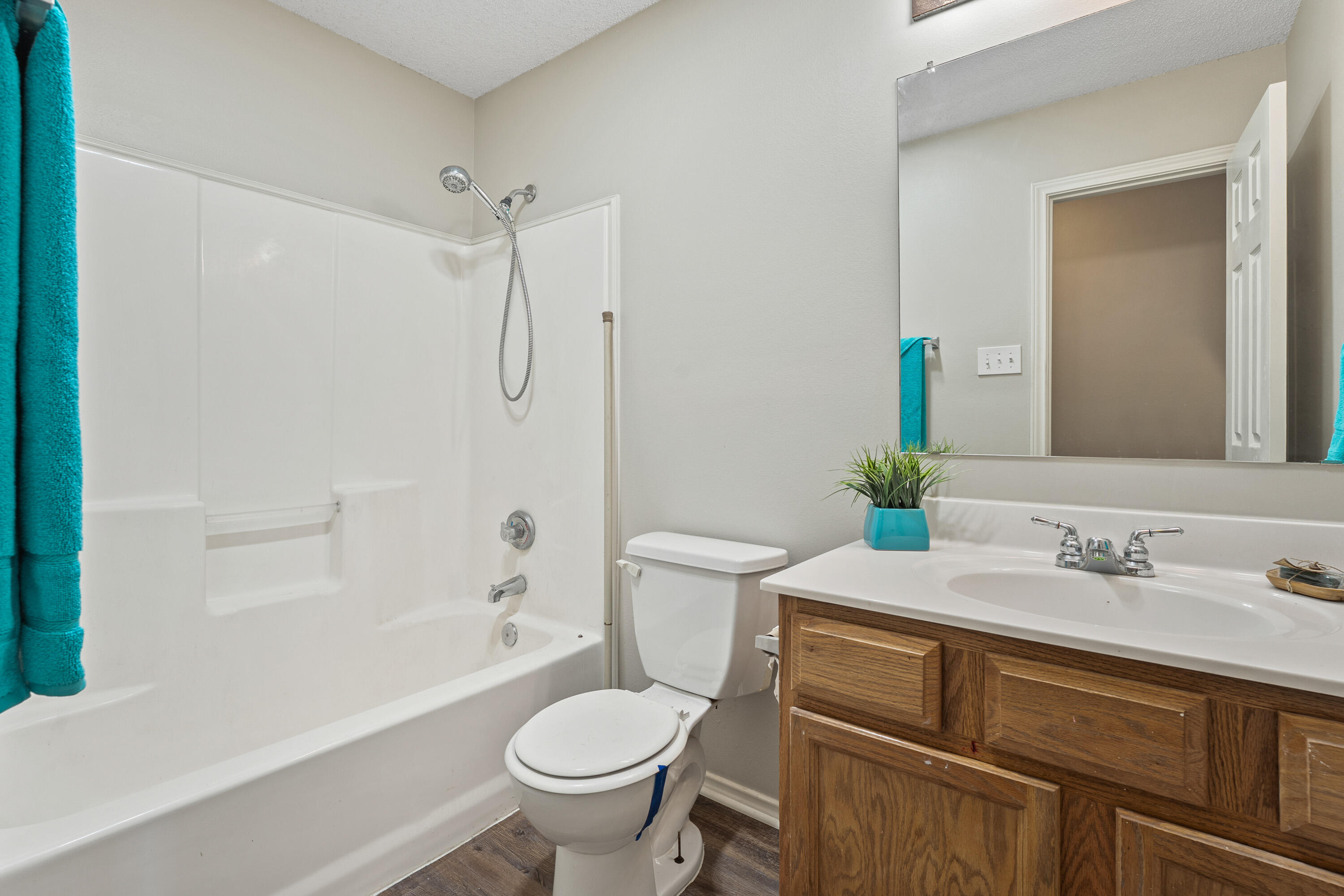 6517 91st Street Lubbock, TX 79424 - Photo 8 of 11 a bathroom with a sink toilet and shower