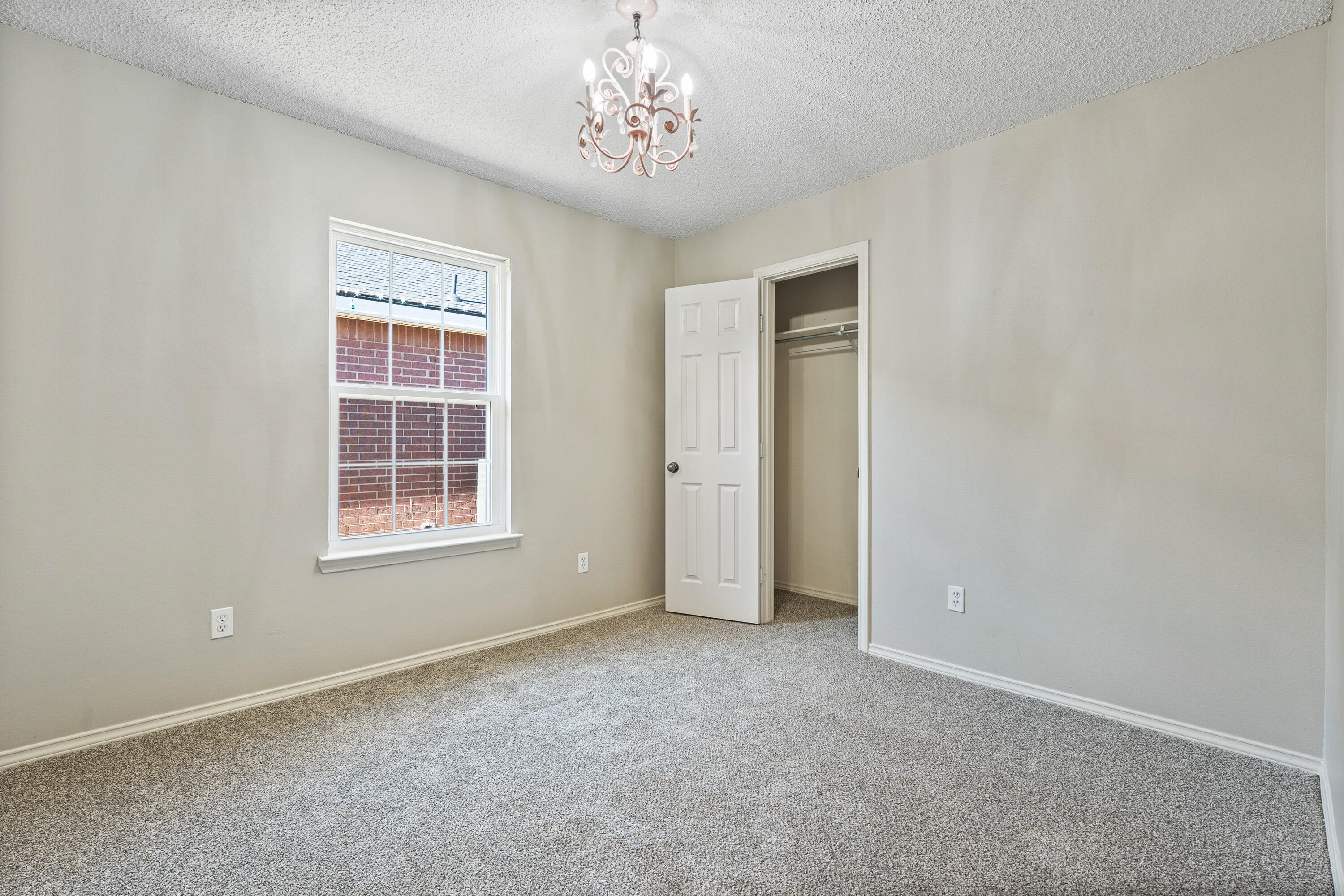 6517 91st Street Lubbock, TX 79424 - Photo 9 of 11 an empty room with windows