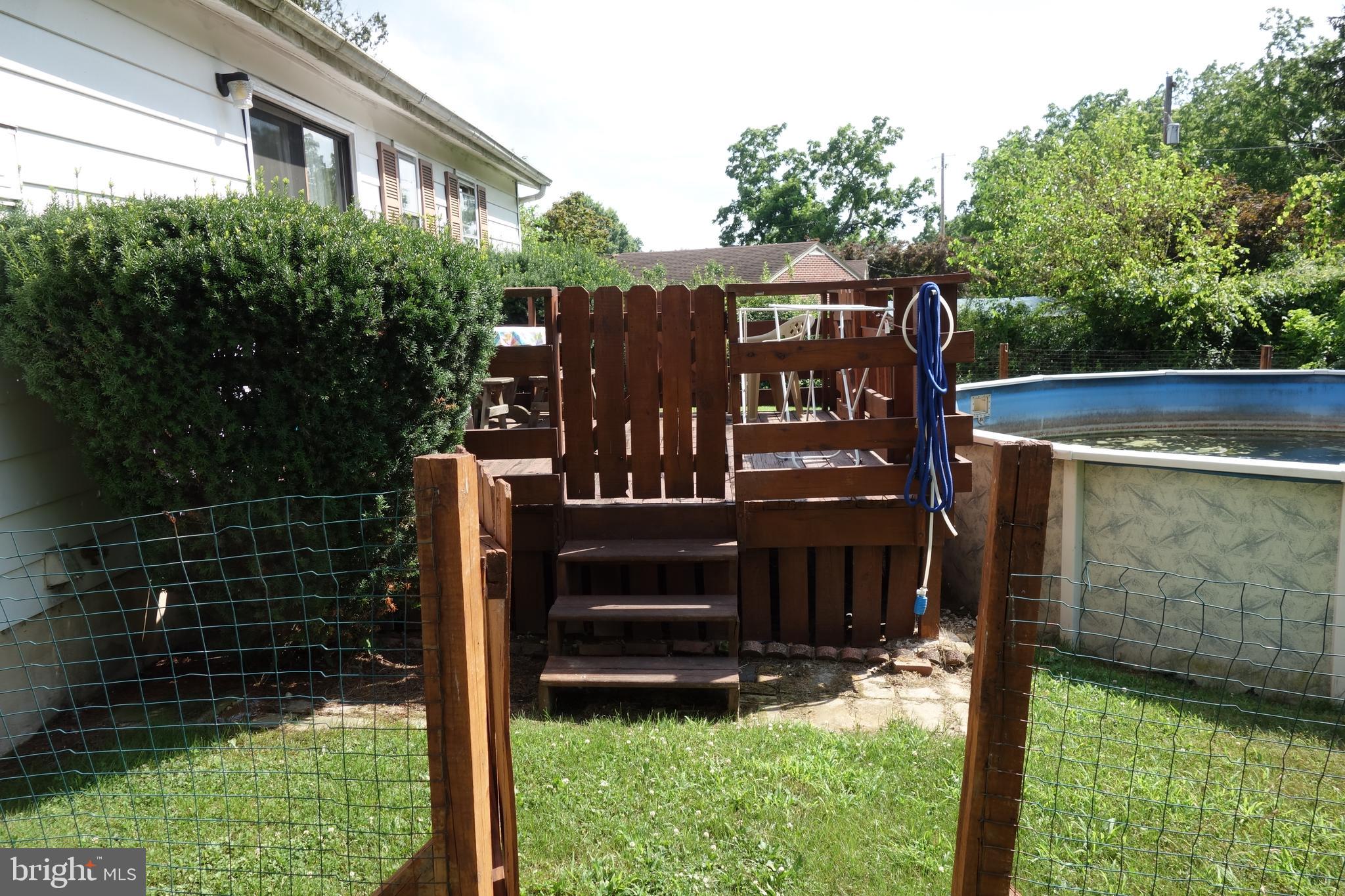 769 Knob Hill Road Fayetteville, PA 17222 - Photo 14 of 56 a view of a house with a yard and wooden fence