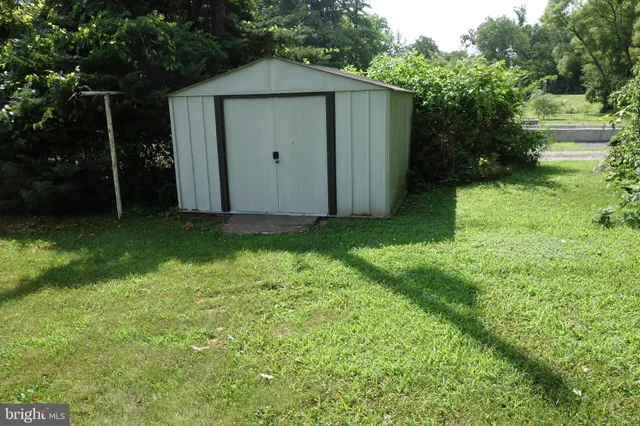 a view of green field with trees
