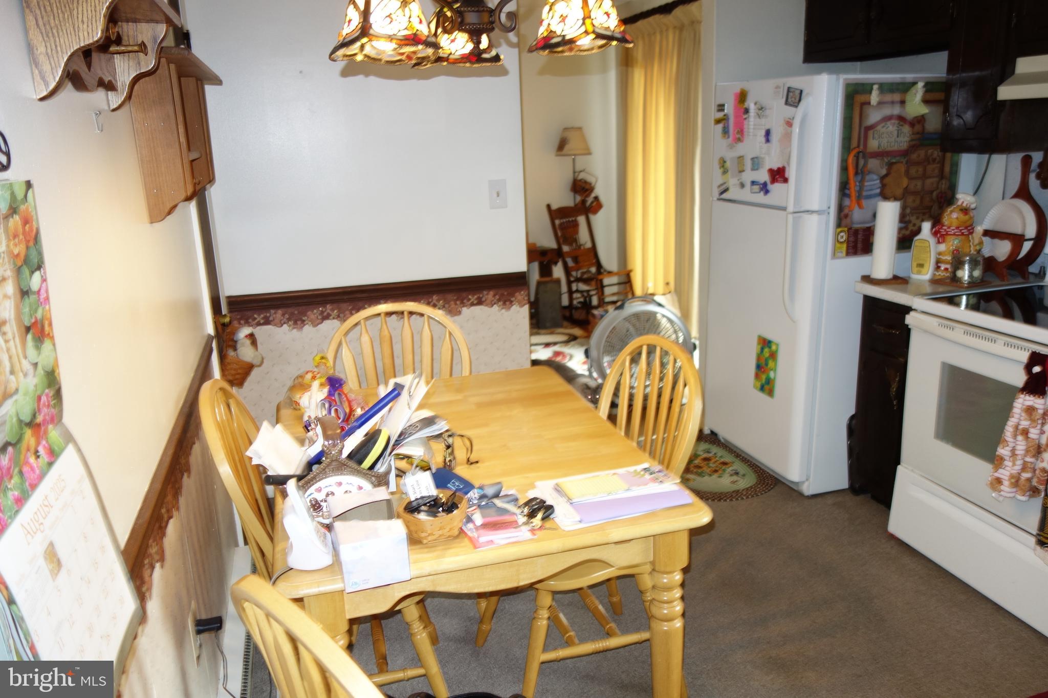 769 Knob Hill Road Fayetteville, PA 17222 - Photo 32 of 56 a dining room with furniture and a chandelier