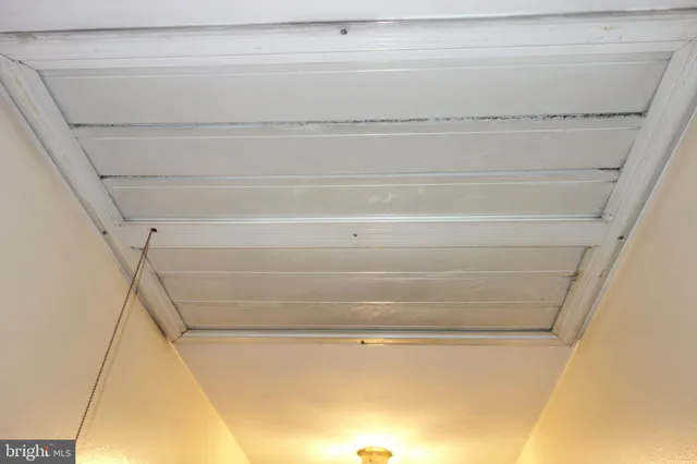 a large bed and a lamp on a table