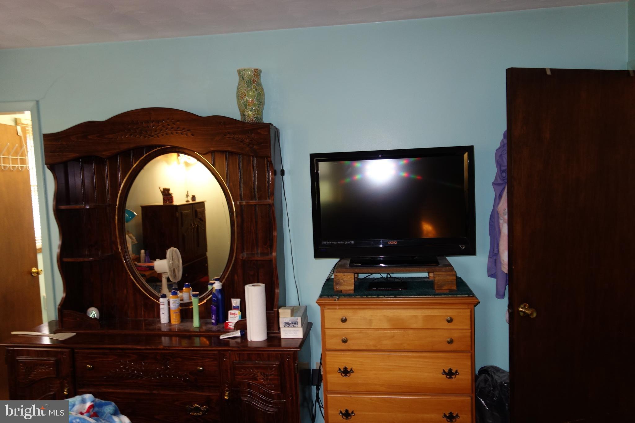 769 Knob Hill Road Fayetteville, PA 17222 - Photo 47 of 56 a room with furniture flat screen tv and glass door