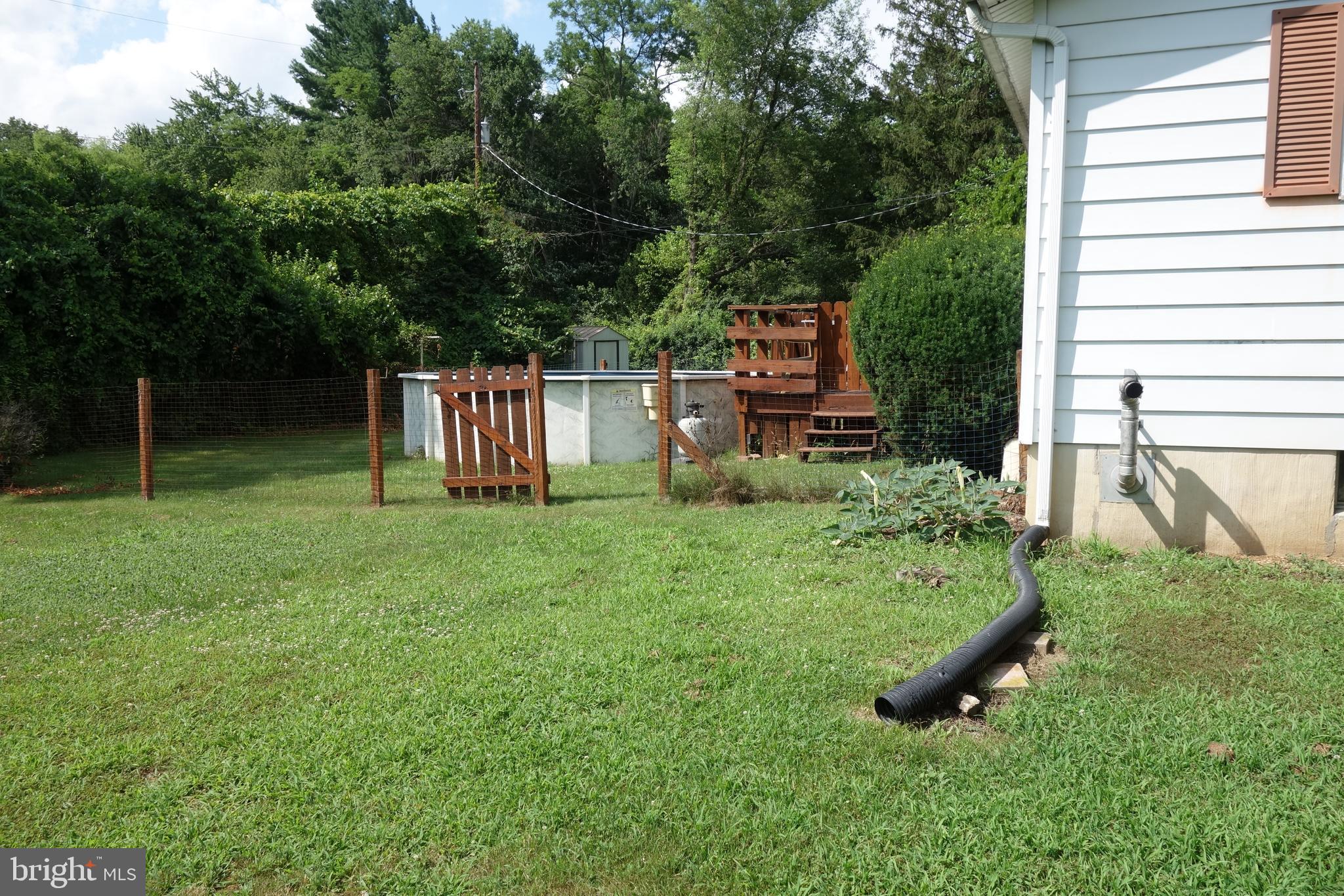 769 Knob Hill Road Fayetteville, PA 17222 - Photo 6 of 56 a backyard of a house with table and chairs