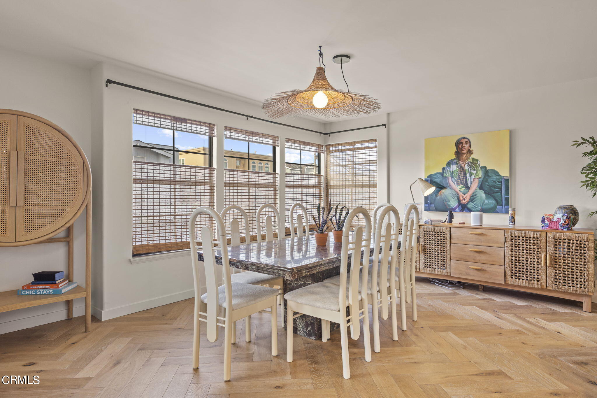 4136 Ocean Drive Oxnard, CA 93035 - Photo 13 of 58 a view of a dining room with furniture a chandelier and wooden floor
